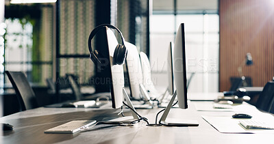 Buy stock photo Empty, office and headset on computer on desk for lead generation, customer support and business. Background, call center and tech, equipment and headphones for contact us, crm service and help