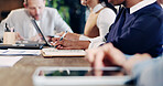 Hands, team and notebook for meeting in office with writing, proposal or review at real estate agency. People, realtor or consultant with tech for investor, property development or budget insight