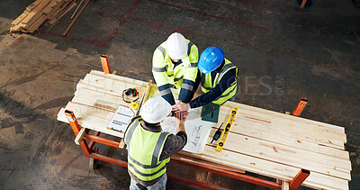 Buy stock photo Meeting, blueprint and men with hand stack for carpentry, construction project and agreement. Warehouse, above and people with teamwork for renovation success with woodworking, building and planning