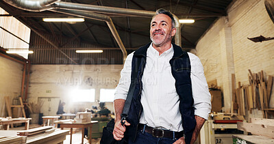 Buy stock photo Man, happy and walking into workshop for carpentry, woodworking and artisan with pride. Below, smile and mature carpenter with bag for arrival at job, lumber or timber with industry trade at plant