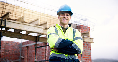Buy stock photo Construction site, civil engineer and man with confidence outdoor, building development and helmet. Arms crossed, portrait and architect with smile, about us and happy professional with safety ppe