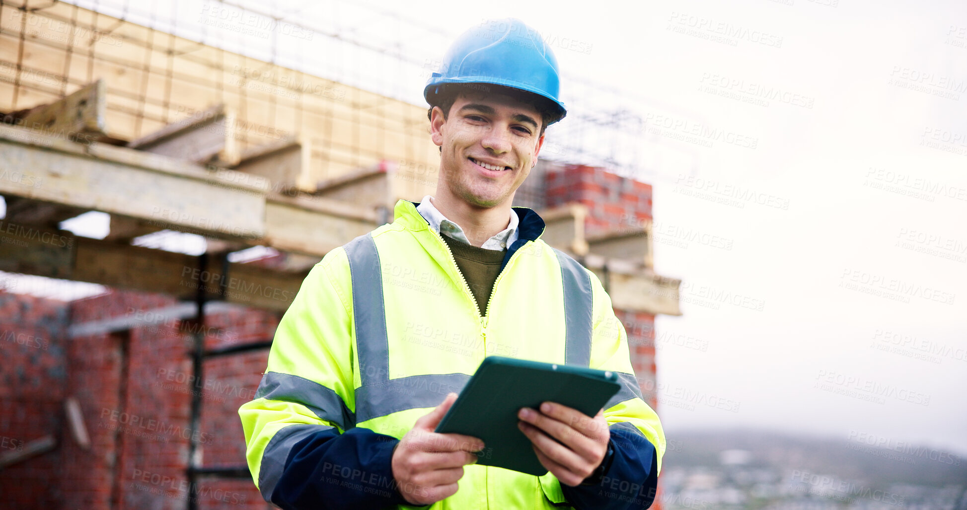 Buy stock photo Construction site, engineer and happy man with tablet outdoor for building development with helmet. Technology, portrait and professional architect with smile, about us or safety inspector with pride