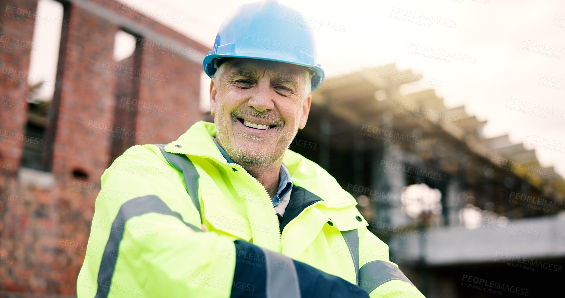 Buy stock photo Construction site, engineer and happy man with arms crossed outdoor for building development with helmet. Confidence, portrait and mature architect with smile, about us or safety inspector with pride
