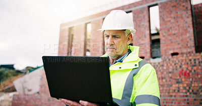 Buy stock photo Reading, man and construction worker on site with laptop for research on building renovation. Computer, plan and mature civil engineer with feedback on maintenance, repairs or property development.