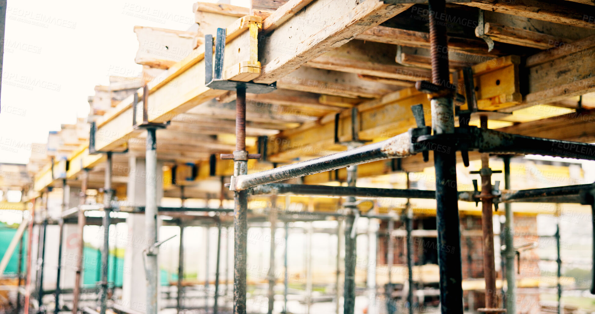 Buy stock photo Construction site, scaffolding and infrastructure for urban development with support, beams and compliance. Empty, building project and steel at worksite for structure, renovation or industrial frame