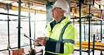 Engineer, man and inspection on construction site with clipboard, safety compliance or evaluation. Manager, mature person and risk assessment in building with checklist, infrastructure review or plan