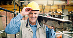 Hardhat, man and portrait of construction worker on site with confidence for building, renovation or repair. Smile, job and mature civil engineer with pride for property development or maintenance.