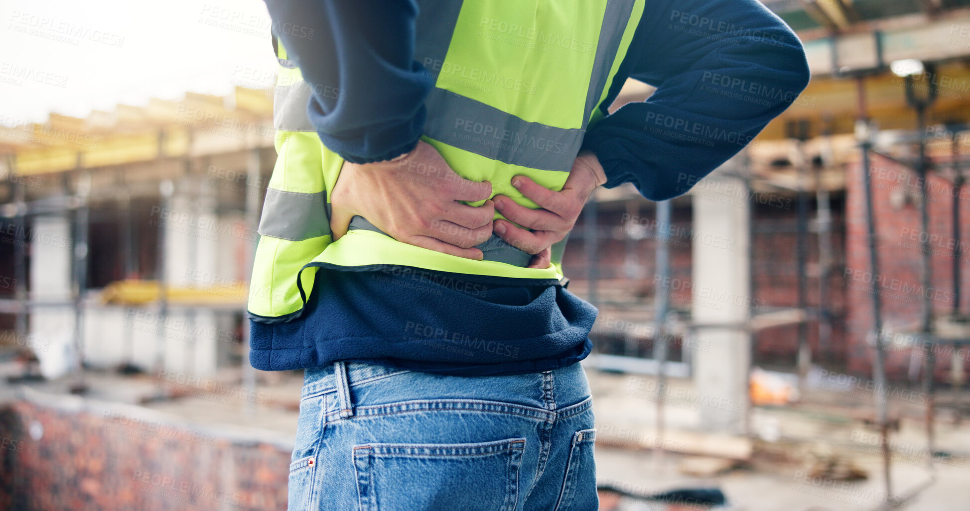 Buy stock photo Back pain, stress and hands of man on construction site with accident, muscle fatigue and tension. Contractor, engineer and person with strain, fibromyalgia and pressure for burnout, posture and hurt