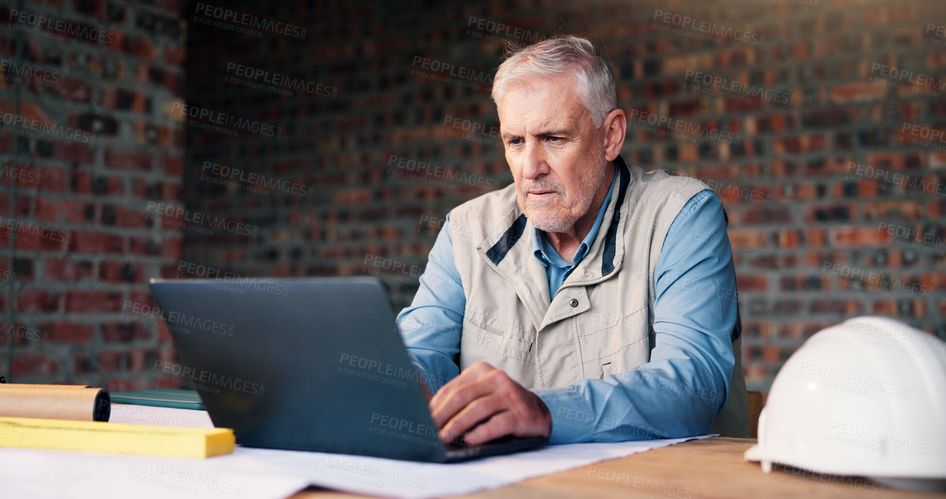 Buy stock photo Man, architect or laptop at construction site for planning, reading building requirement or online. Mature engineer, computer or network at worksite for project management, insight or progress report