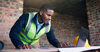 Buy stock photo Architect, man and research with laptop in building, renovation or planning for property development. Project, online and black person with blueprint, design and civil engineering with technology