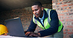 Black man, laptop and typing online for architect planning, research or strategy at construction site. Person, tech and engineer with internet for CAD, software and productivity for civil engineering