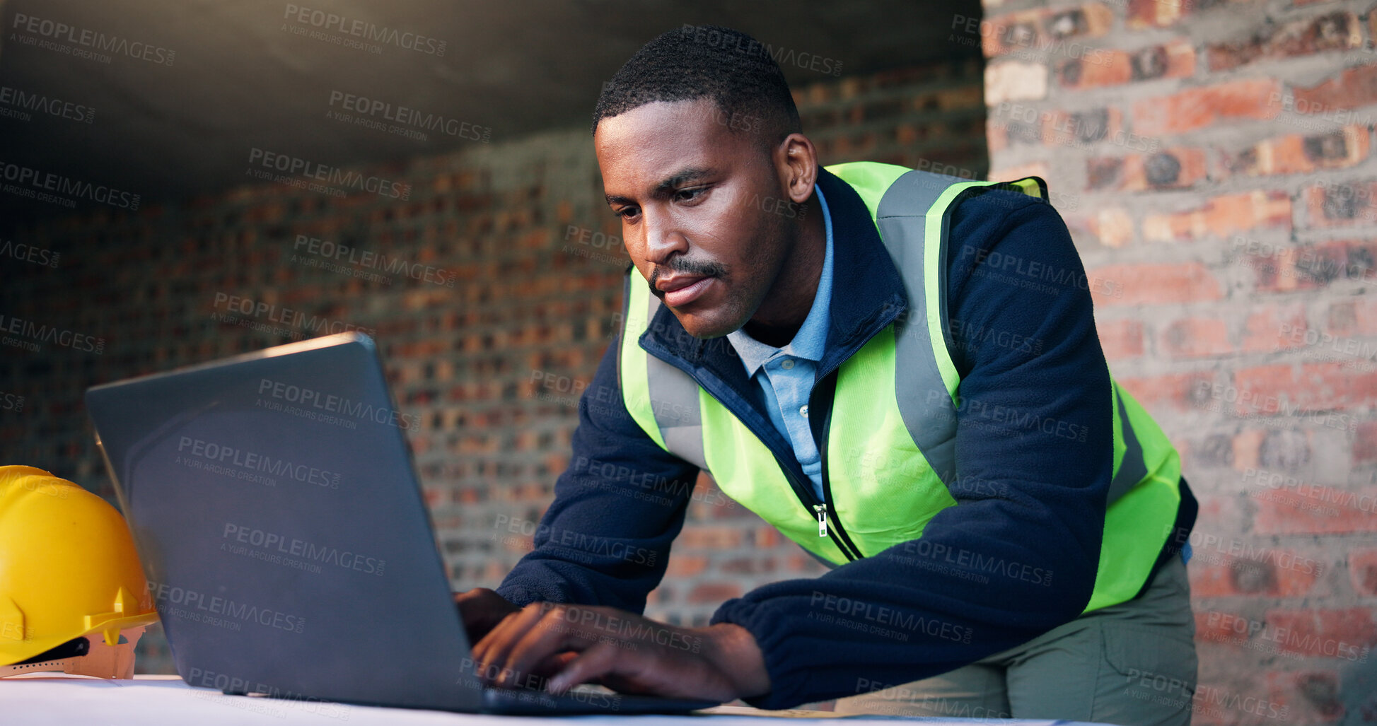 Buy stock photo Black man, laptop and typing online for architect planning, research or strategy at construction site. Person, tech and engineer with internet for CAD, software and productivity for civil engineering