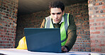 Online, laptop and man reading for architect planning, research or strategy at construction site. Person, technology and engineer on internet for CAD, serious and productivity for civil engineering