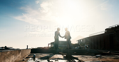 Buy stock photo Construction, silhouette or people on rooftop with handshake, greeting or deal in building project. Space, flare or engineer outdoor with shaking hands, agreement or approval in industrial expansion.
