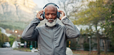 Buy stock photo Fitness, headphones and portrait of black man outdoor for start of training or workout routine. Exercise, music and serious with mature runner in neighborhood for cardio challenge or streaming