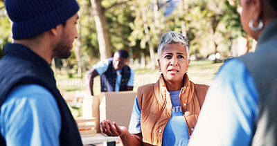 Buy stock photo Volunteer, woman and conversation in park with team, manager instructions or outreach for non profit. People, discussion and charity project outdoor with social responsibility, planning or NGO group.