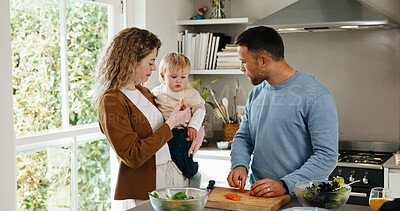 Buy stock photo Family, baby and taste with cooking in kitchen of home for bonding, nutrition and support. People, parents and child with carrot for meal prep with ingredients, salad or vegetable for healthy diet