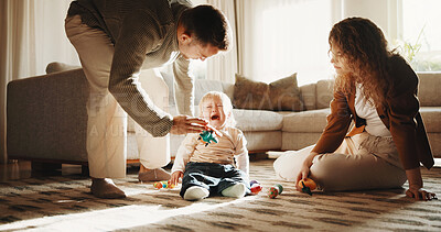 Buy stock photo Parents, crying and baby at house with toys, tantrum and emotional support for nurturing toddler. Sad, child and people in home for distraction, sensory overload and teething discomfort for childcare