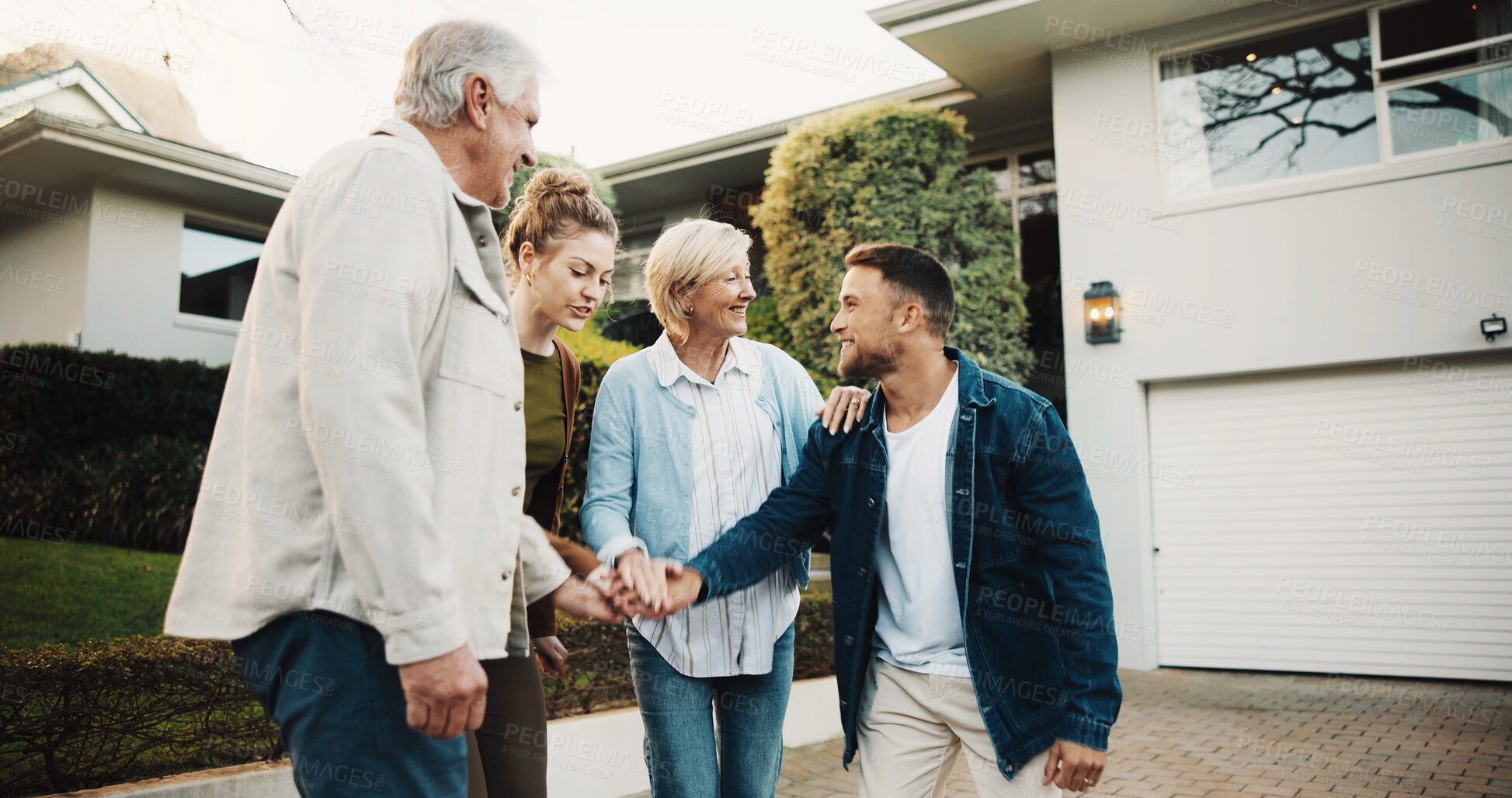 Buy stock photo Real estate, smile and stack of hands with family at new home for celebration or relocation. Congratulations, couple and senior parents in front yard of apartment for property investment or purchase