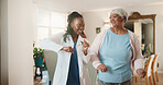 Doctor, dance and senior woman in house for healthcare recovery, rehabilitation and smile for wellness. Retirement, medical worker and moving with happy person, mobility exercise and homecare visit