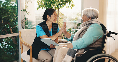 Buy stock photo High five, nurse and tablet with old woman with disability for advice, consulting or results. App, checkup and medical professional talking to senior patient in wheelchair for home rehabilitation