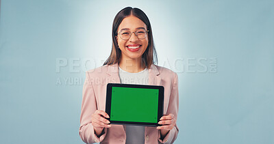 Buy stock photo Tablet, portrait or happy woman with green screen in studio for business mockup on a blue background. Female person, employee or smile with technology display for UI, UX or app review on space