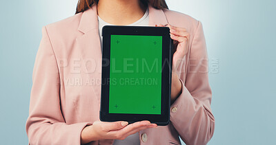 Buy stock photo Tablet, woman and hands with green screen in studio for marketing mockup on a blue background. Female person, employee or presentation with technology display for advertising or app review on space