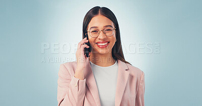 Buy stock photo Phone call, smile and business woman in studio for insurance negotiation, portrait or space. Mobile, broker and happy person listen to contact, premium benefits or coverage options on blue background