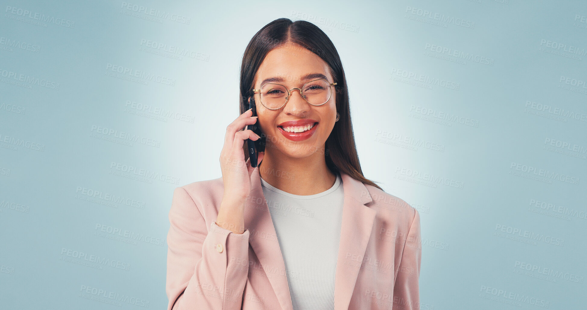 Buy stock photo Phone call, smile and business woman in studio for insurance negotiation, portrait or space. Mobile, broker and happy person listen to contact, premium benefits or coverage options on blue background
