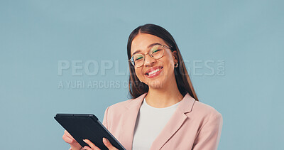 Buy stock photo Happy, businesswoman and portrait in studio with tablet, internet or pride for web design career. Digital designer, person and smile with tech, glasses or about us for creative job on blue background