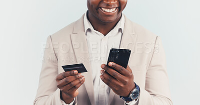 Buy stock photo Phone, credit card and hands in studio for business payment, financial transaction or banking. Mobile, happy man and debit for online shopping, corporate purchase and investment on white background