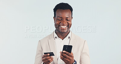 Buy stock photo Phone, credit card and business man in studio for payment, financial investment or banking with space. Mobile, happy black person or debit for online shopping, corporate purchase and white background
