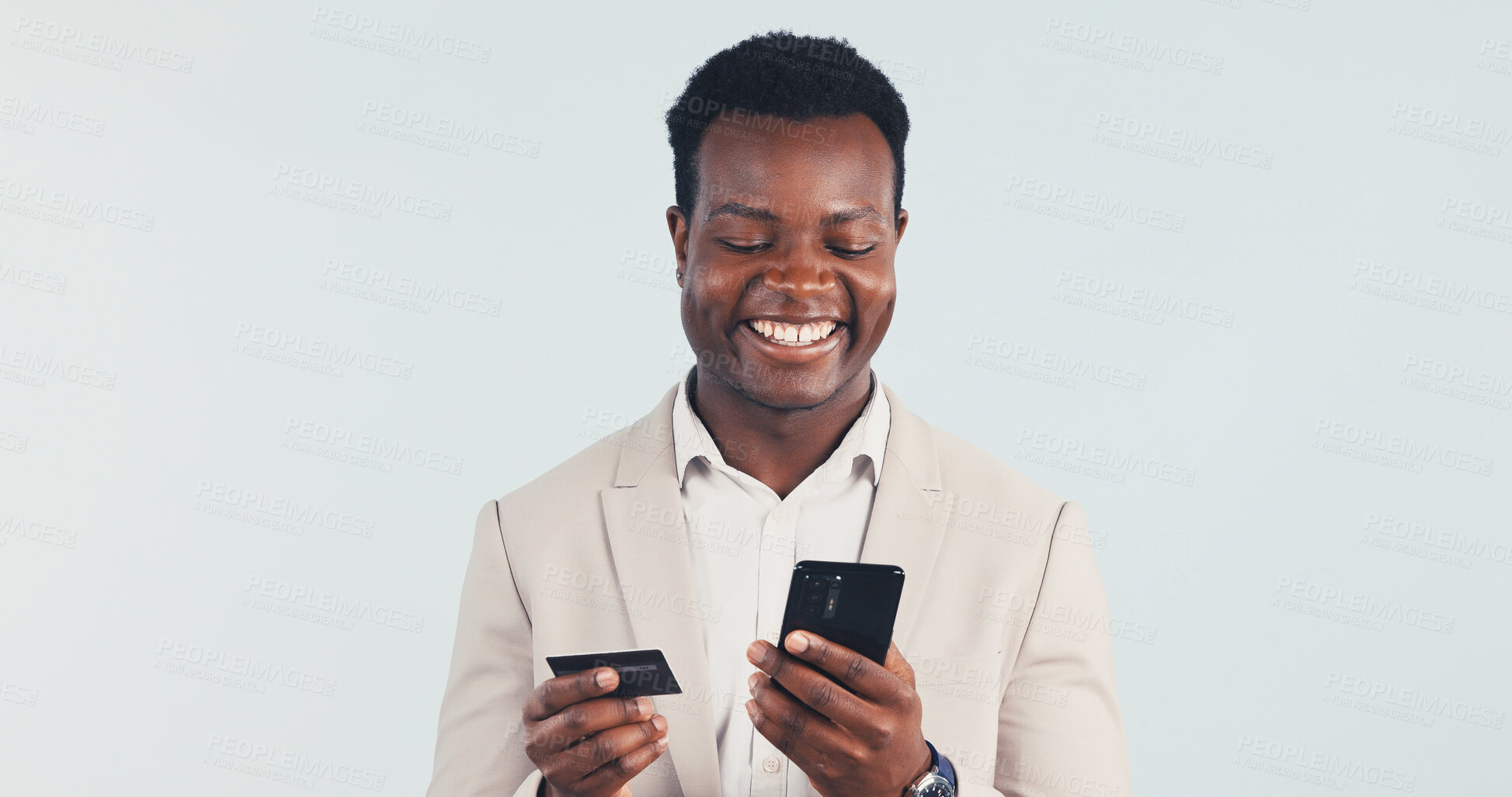 Buy stock photo Phone, credit card and business man in studio for payment, financial investment or banking with space. Mobile, happy black person or debit for online shopping, corporate purchase and white background