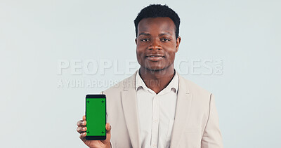 Buy stock photo Portrait, businessman and phone in studio with green screen, internet or website for digital marketing. Black person, tech or job for advertising mobile app, online or mockup space on blue background