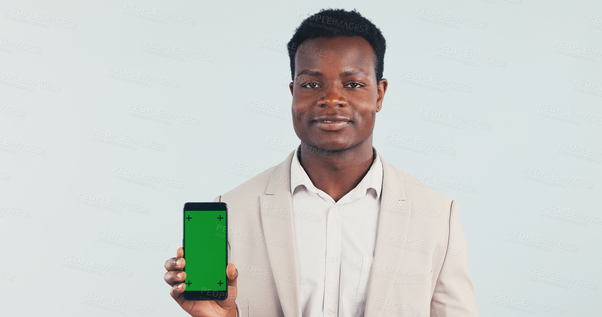 Buy stock photo Portrait, businessman and phone in studio with green screen, internet or website for digital marketing. Black person, tech or job for advertising mobile app, online or mockup space on blue background