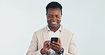 Happy, businessman and scroll in studio with phone, text message and good news for finance company. Space, black person and financial advisor with tech, app and positive feedback on white background.