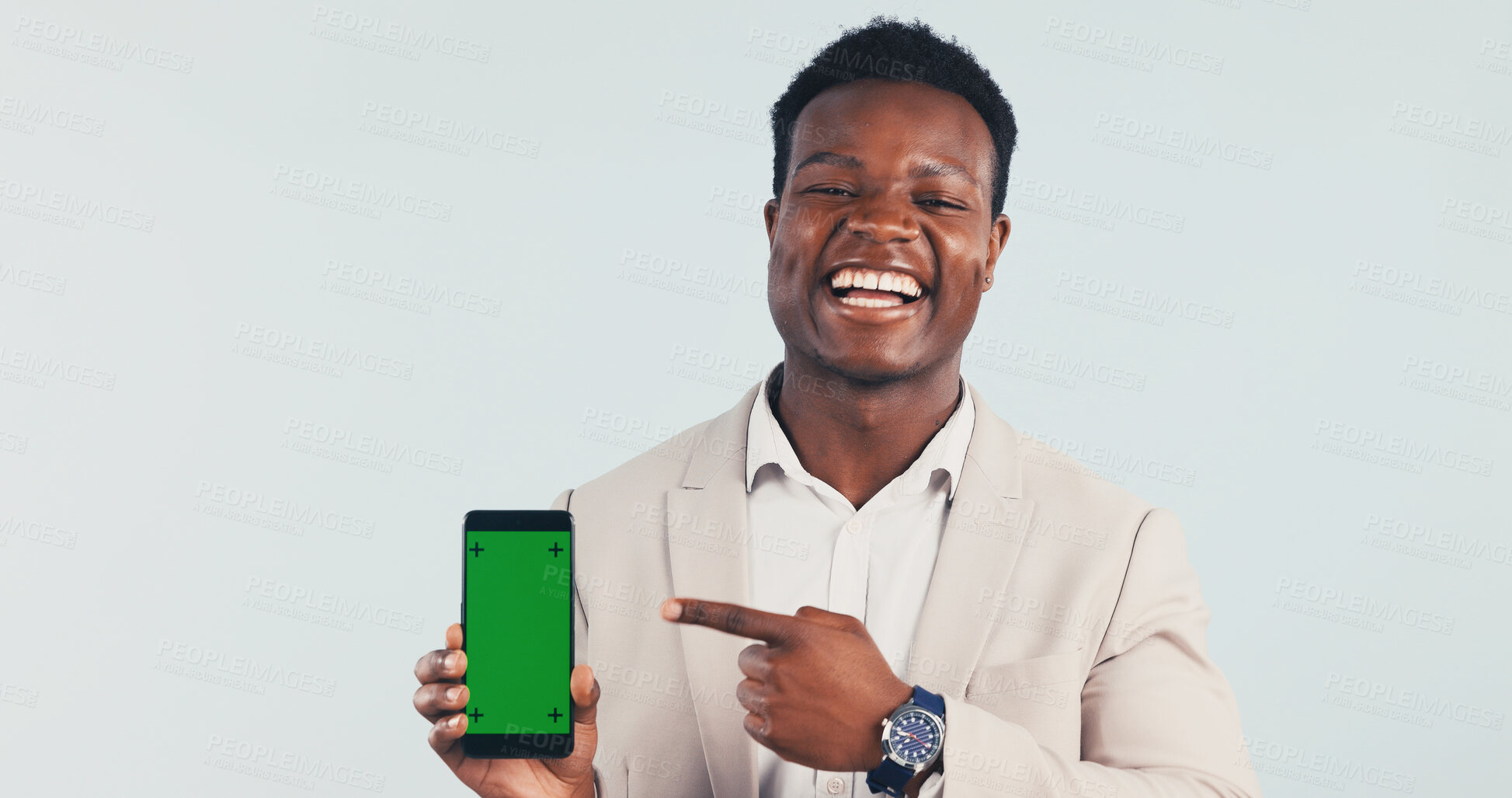 Buy stock photo Pointing, green screen and black man with phone in studio for advertising finance mobile app. Happy, portrait and financial advisor with cellphone mockup for internet banking on white background.