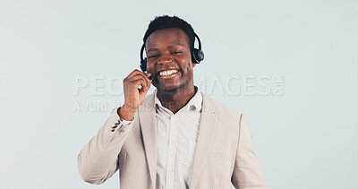 Buy stock photo Help, black man and smile with headset in studio, call center consultant and customer service feedback. Listen, mic and support agent with assistance, contact us and communication on white background