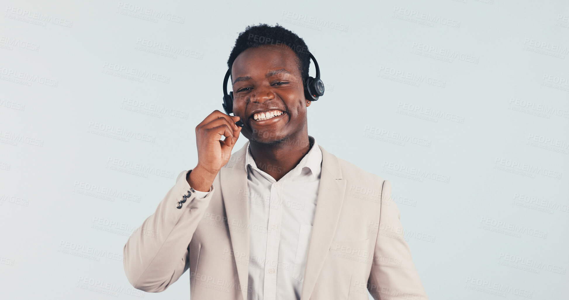 Buy stock photo Help, black man and smile with headset in studio, call center consultant and customer service feedback. Listen, mic and support agent with assistance, contact us and communication on white background