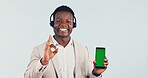 Green screen, call center and black man with phone in studio for crm, contact us or enquiry with headset. Happy, portrait and technical support agent with ok gesture on cellphone on white background.