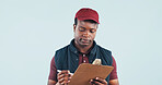 Logistics, clipboard and delivery man reading in studio with receipt, postal service or customer order. Space, black person and courier with checklist, distribution and shipping on blue background.