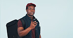 Lost, confused and delivery man with phone in studio for directions, shipping address and location. Space, mockup and African person on cellphone for map, search or courier service on blue background