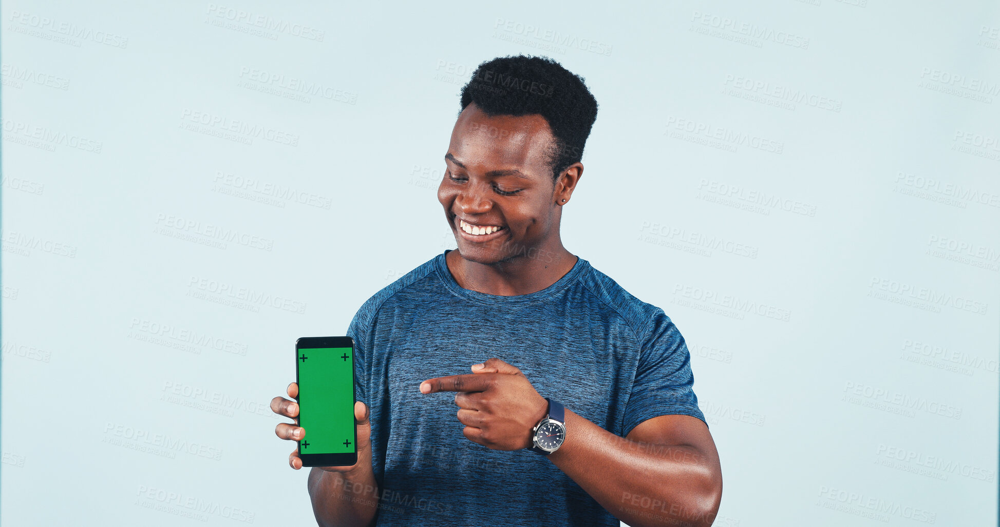 Buy stock photo Man, phone or green screen in studio with pointing for promotion, fitness or social media. Mockup space, gesture or happy black person with tech for app or online exercise program on white background