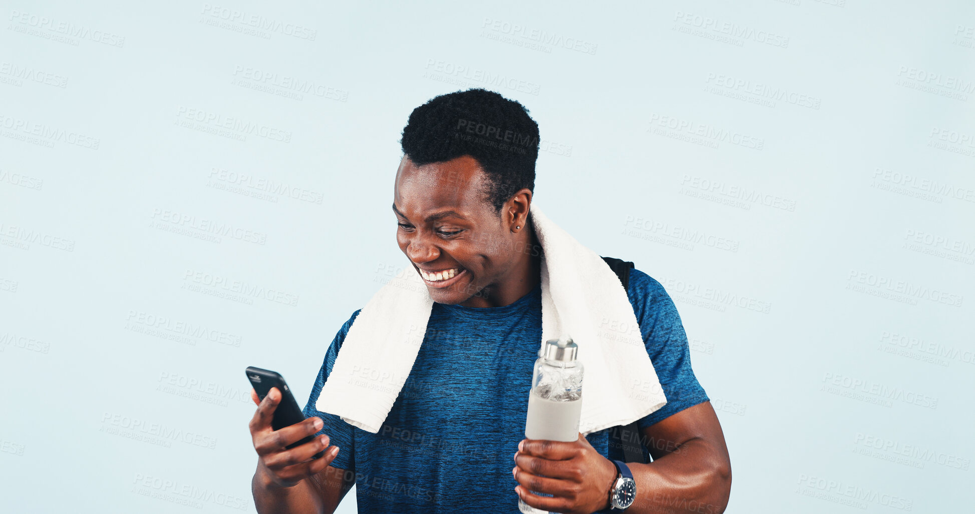 Buy stock photo Excited, black man and fitness in studio with phone, good news and winner for free membership. Mockup space, male person and bottle with mobile, sports competition and achievement on blue background