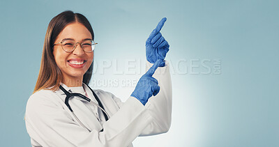 Buy stock photo Medical, portrait and doctor with pointing, treatment list and reminder on wellness info. Mockup space, happy woman and gp with instruction, recovery plan and healthcare insight on studio background.