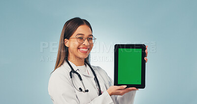 Buy stock photo Laugh, tablet and portrait of doctor with green screen, mockup space or healthcare news. Happy, advertising and woman on tech for medical service, telehealth app or wellness info on studio background