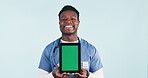 Green screen, nurse or man with tablet, healthcare advertising or telehealth on background. Happy black person, tech or medical worker with display for mockup space, marketing or portrait in studio
