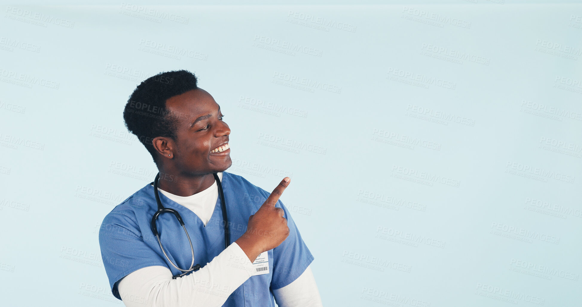 Buy stock photo Happy, nurse and man in studio pointing for health news, announcement and medical service. Mockup, space and African person with gesture for healthcare, wellness tips and info on blue background