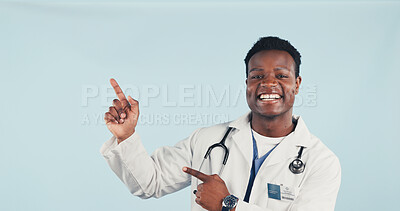 Buy stock photo Doctor, portrait and happy man in studio, point and recommendation for healthcare service and space. Blue background, medical expert and black person with smile, offer and advice for health options