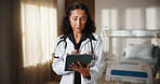 Doctor, woman and tablet in hospital with internet for schedule, planning or medical research. Mature person, technology and serious on Telehealth app for healthcare, information or advice on website